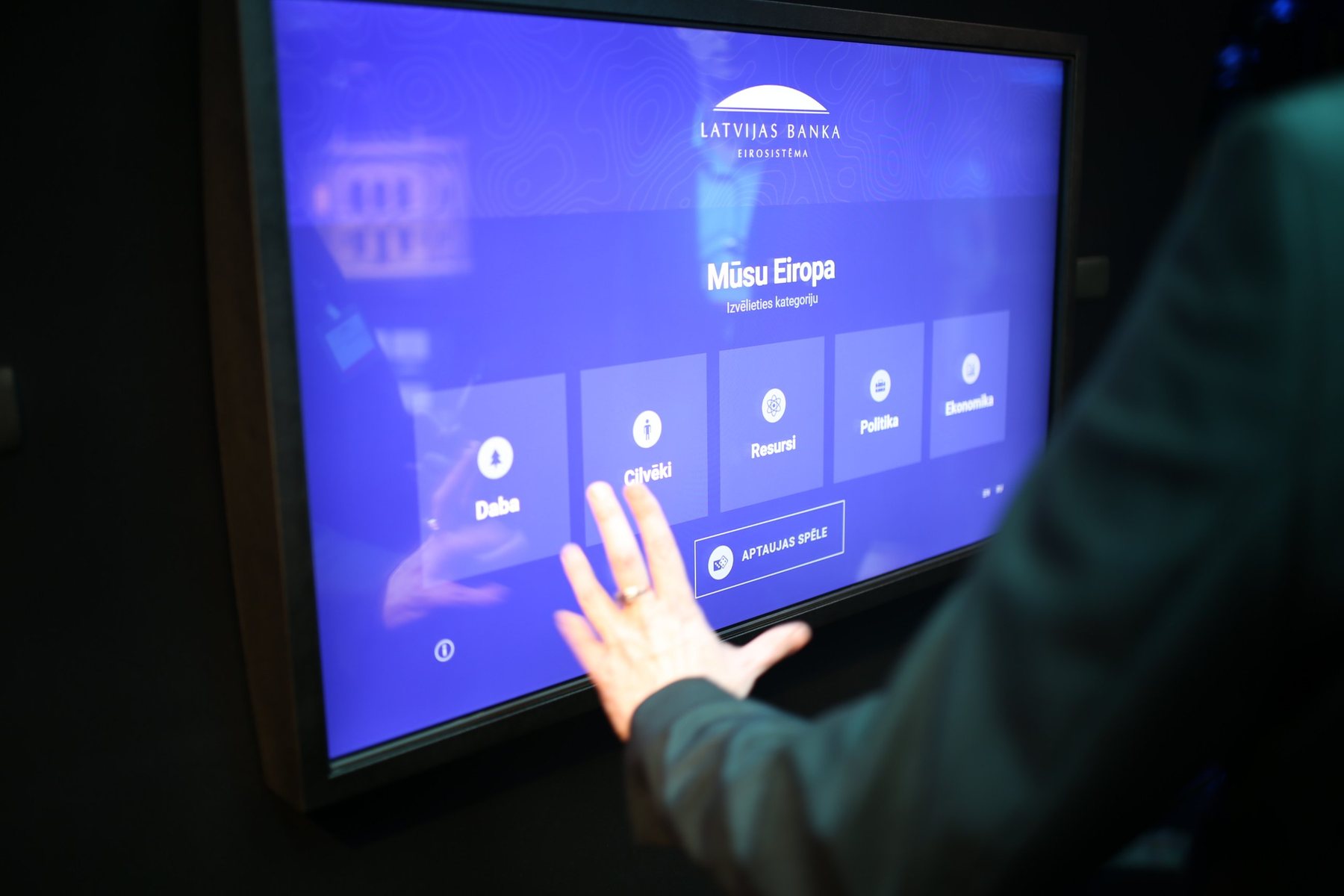 A visitor exploring the data visualization on the museum’s largest touchscreen