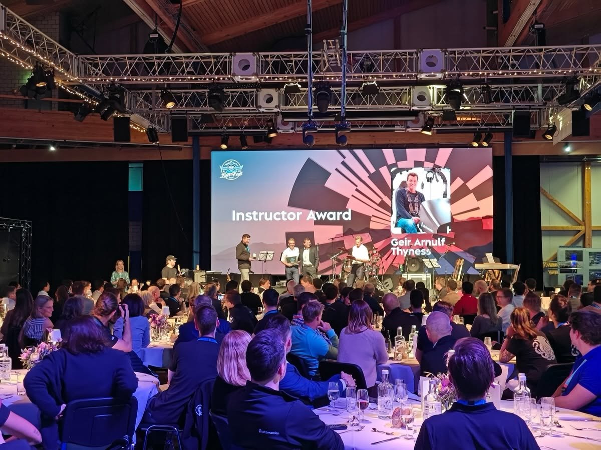Award ceremony at Loft Fest, with the Instructor Award shown on the main stage screen