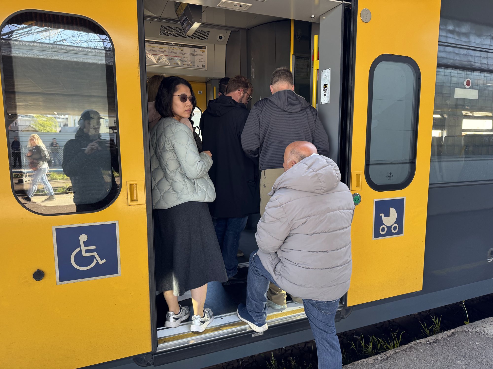 Passengers queueing at a train door